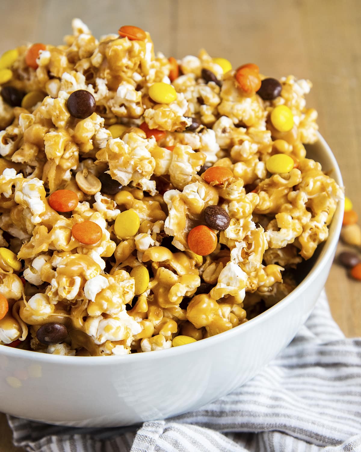 Peanut butter covered popcorn, stuffed full of reeses pieces candies, and salted peanuts.