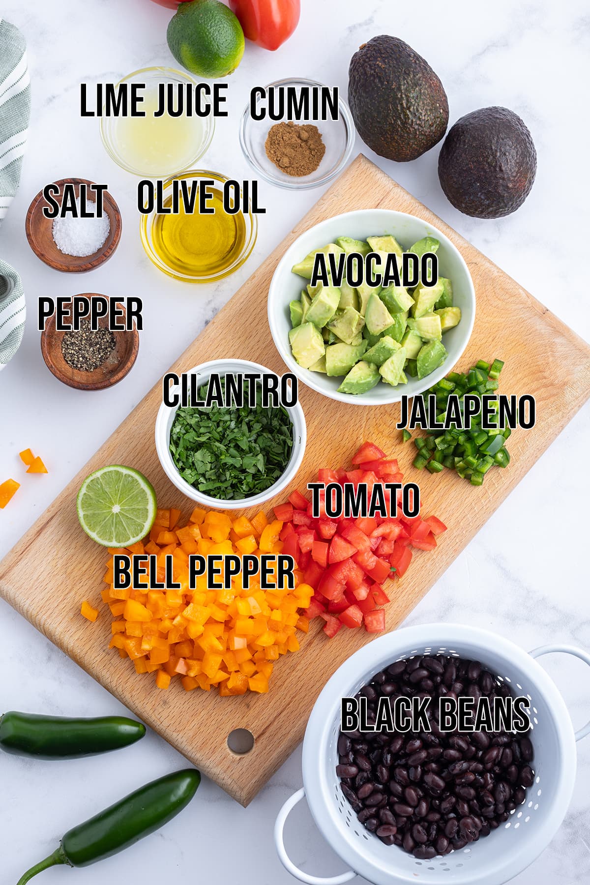 An overhead photo of the ingredients needed to make avocado black bean salad.