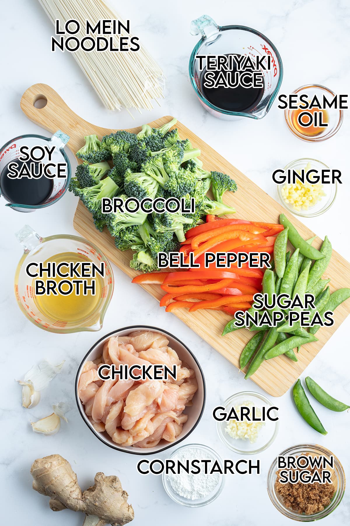 An overhead photo of the ingredients needed to make chicken lo mein at home.