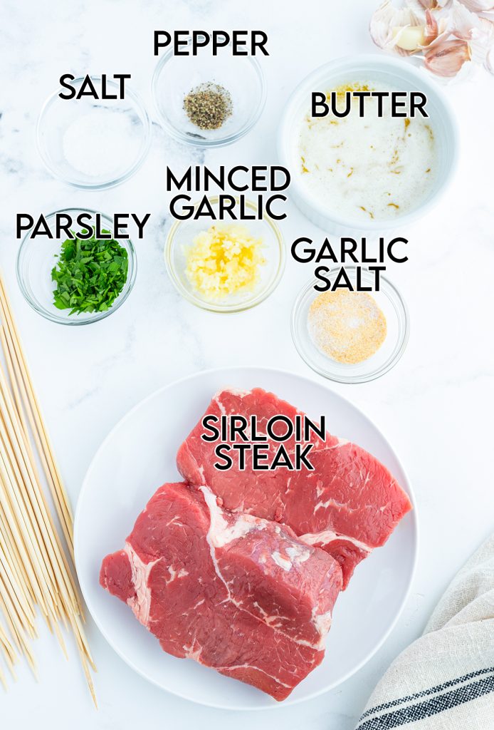 An overhead photo of the ingredients needed to make garlic steak kabobs.
