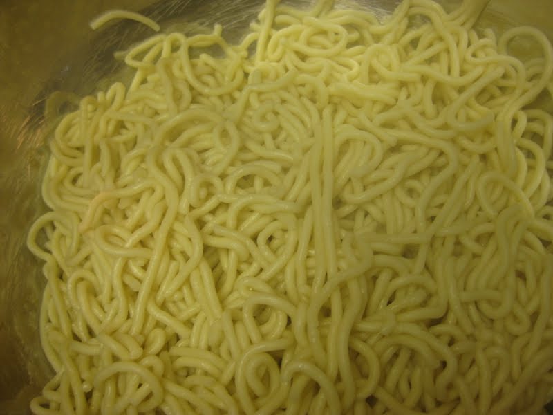 A bowl of homemade spaghetti noodles.