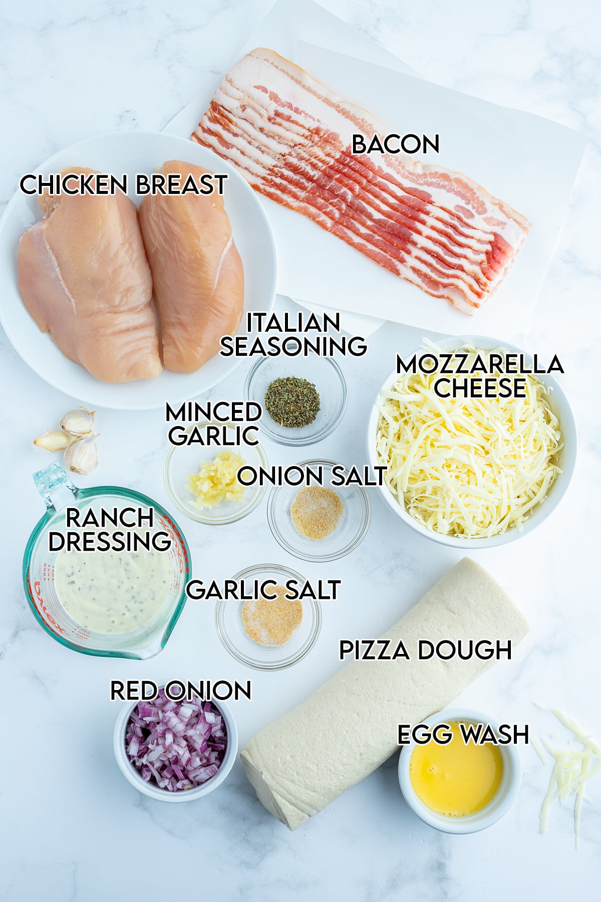 An overhead photo of the ingredients needed to make chicken bacon calzones.