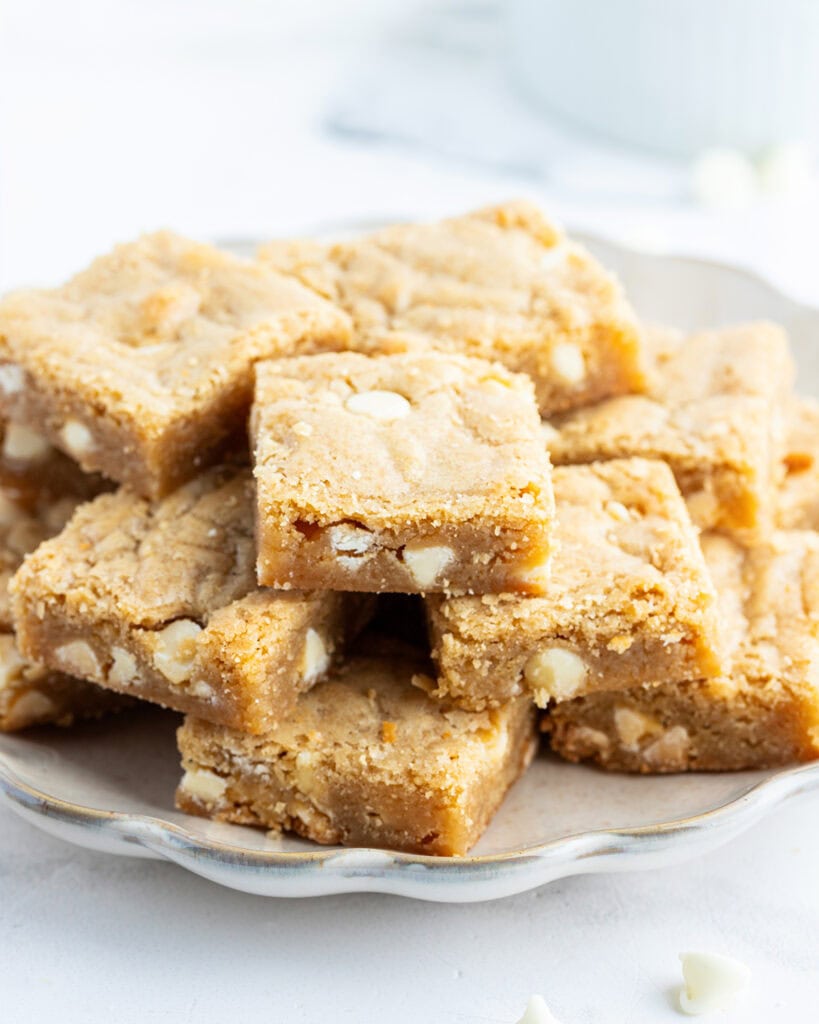 A plate of cookie bars in a pile.