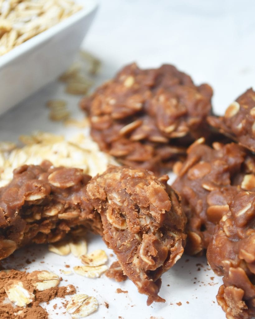 A picture of a no bake cookie broken open next to 3 additional cookies 