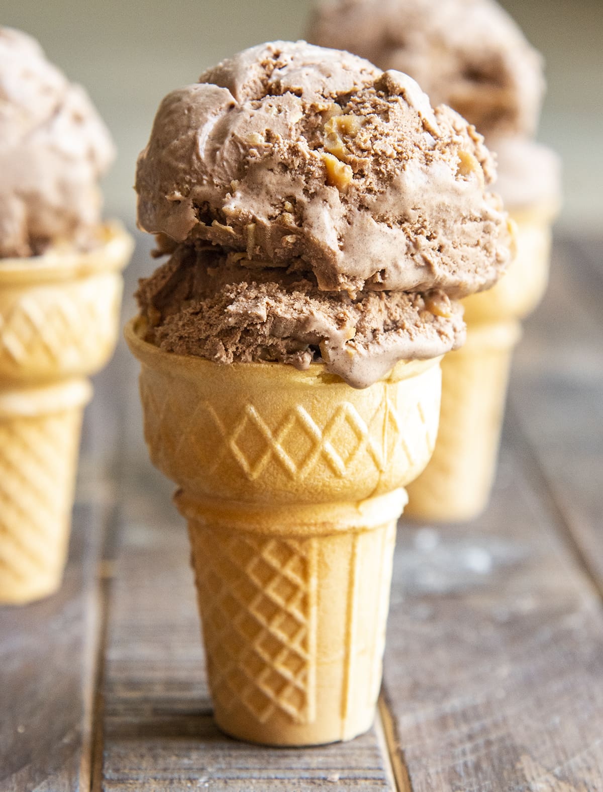 An ice cream cone of chocolate peanut butter ice cream.