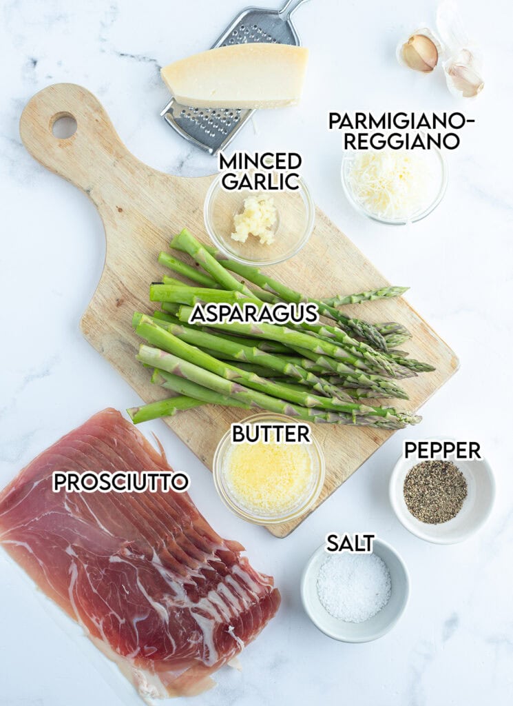 An above view of the ingredients needed to make prosciutto wrapped asparagus with parmesan.