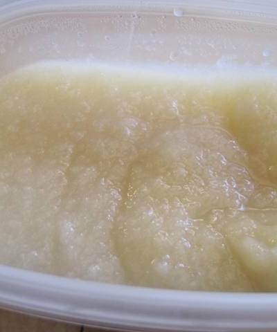 Close up view of pearsauce in a white bowl.