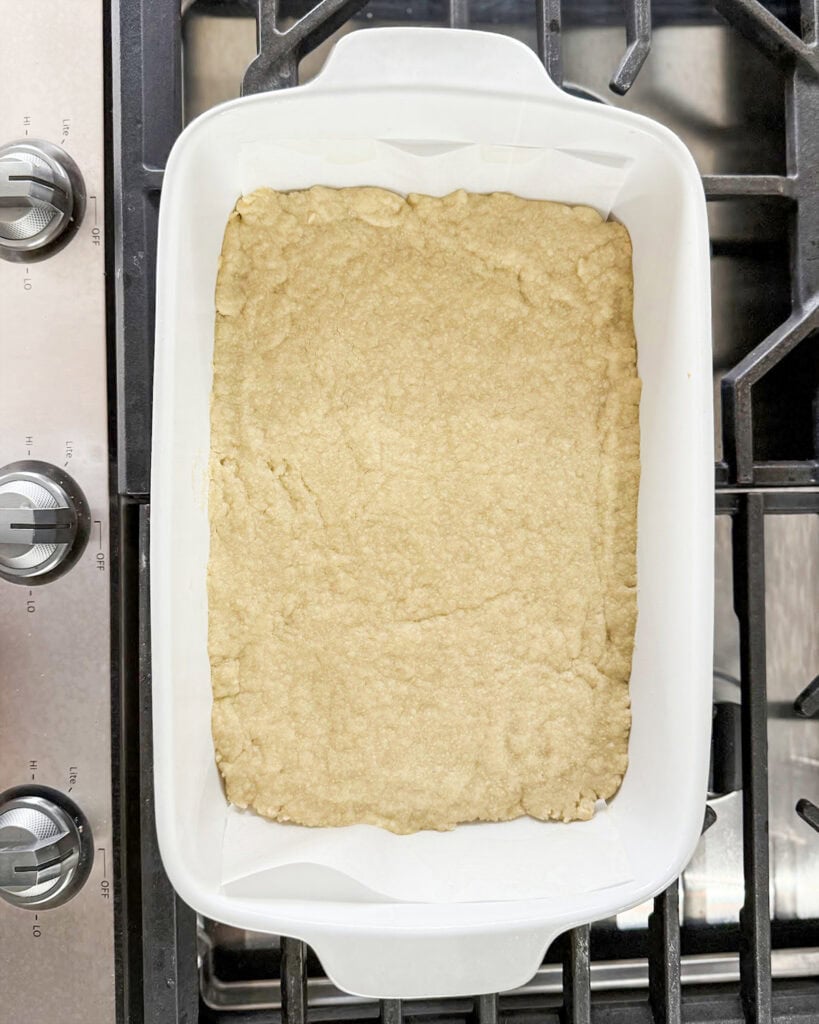 A baked shortbread crust in a pan.