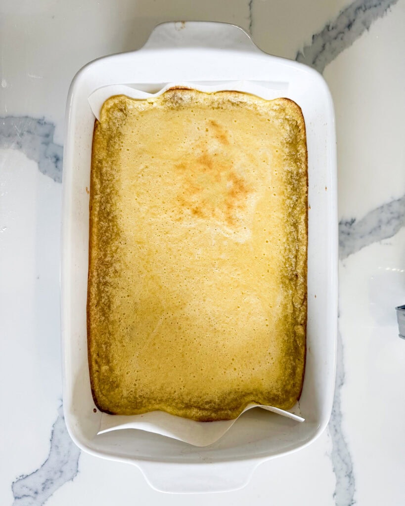 An above view of a baked pan of lemon bars.