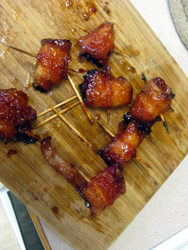 Top view of sweet bacon wrapped pineapple on a wood board.