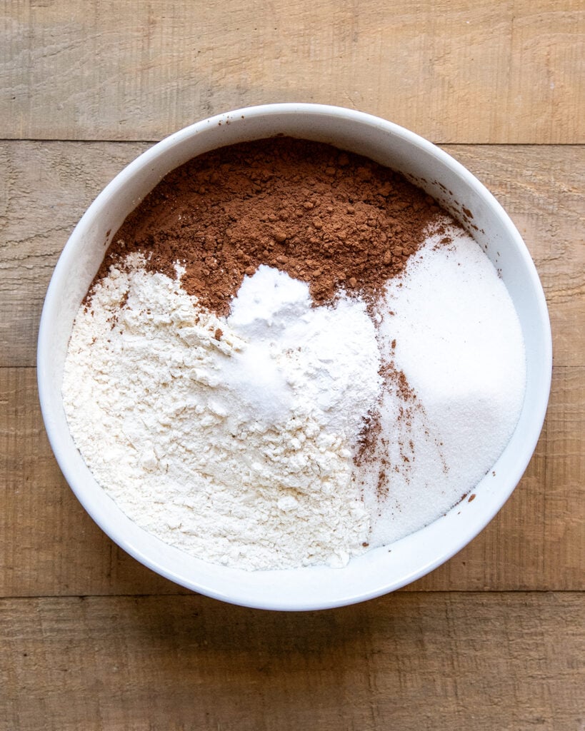 A bowl of flour, sugar, and cocoa powder. 