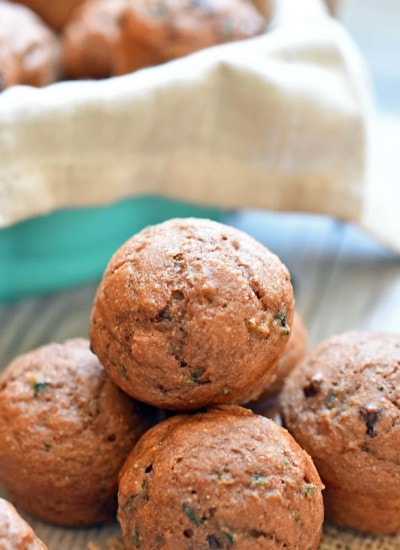 Chocolate zucchini muffins are doubly good with double chocolate of cocoa powder and chocolate chips, and of course grated zucchini. There is no added oil, applesauce is used instead. There is no added sugar, honey is used to sweetened. This is a healthy muffin just perfect for breakfast or snacking.