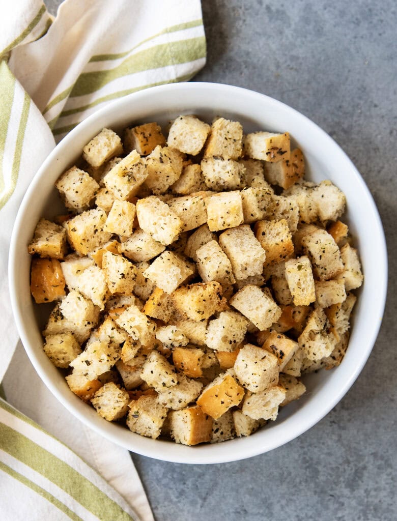 An above photo of croutons in a bowl.