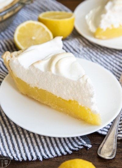 A piece of lemon meringue pie on a plate.