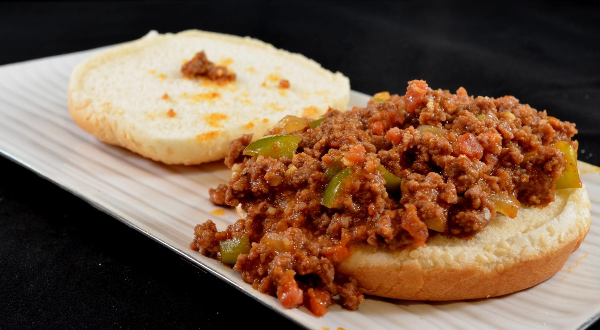 012 Angled view of sloppy joes on a white plate.