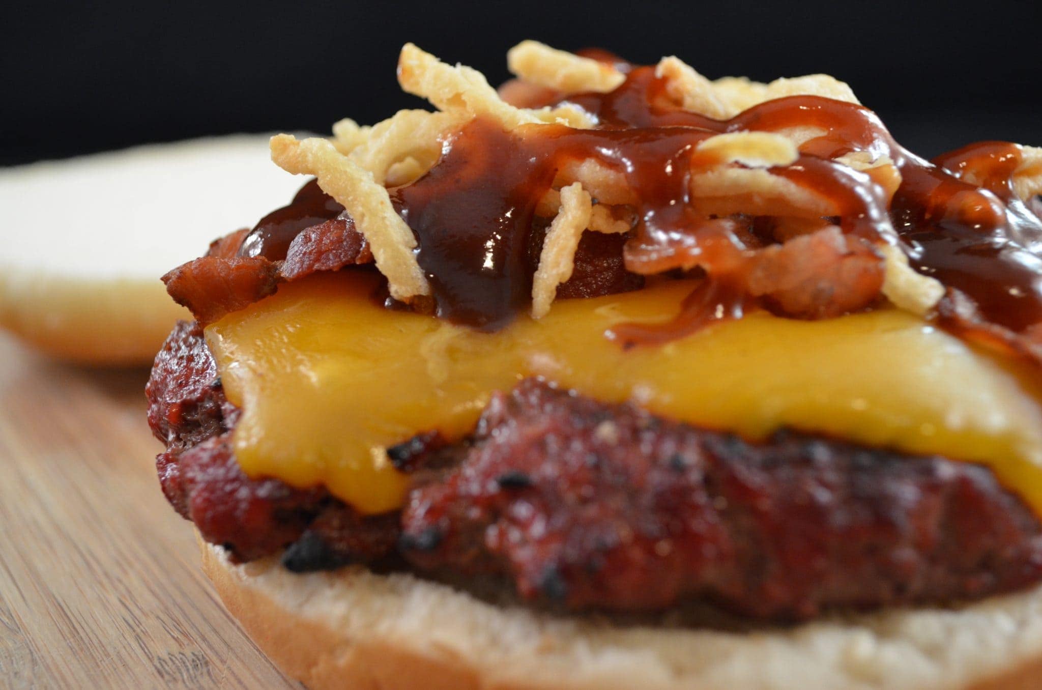 Close up view of western burgers with cheese and bbq sauce.
