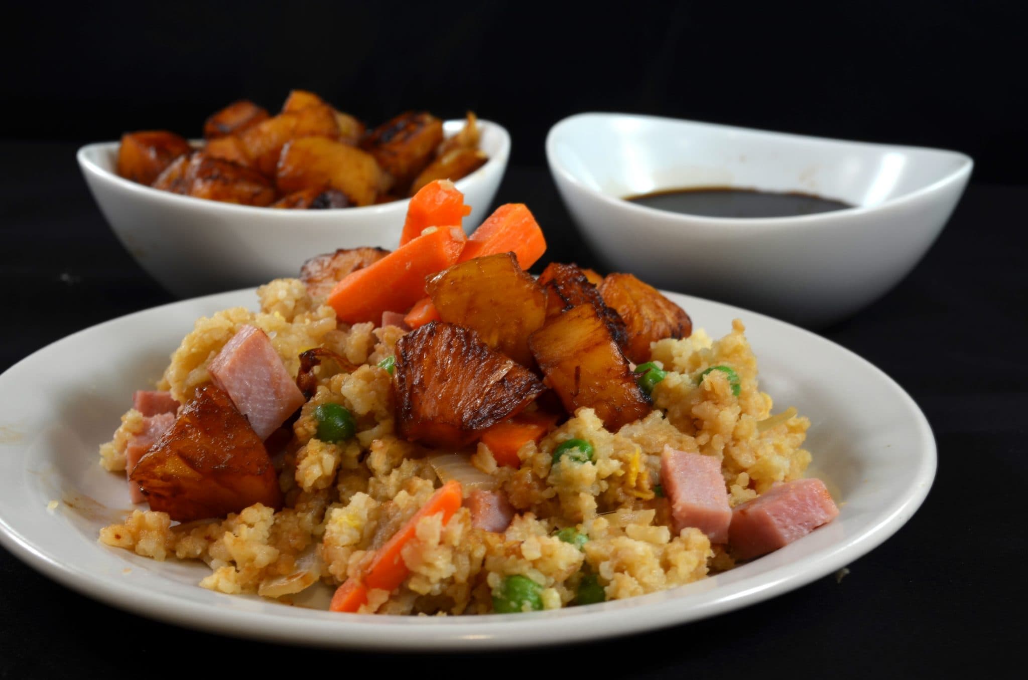 Close up view of pineapple fried rice on a plate.