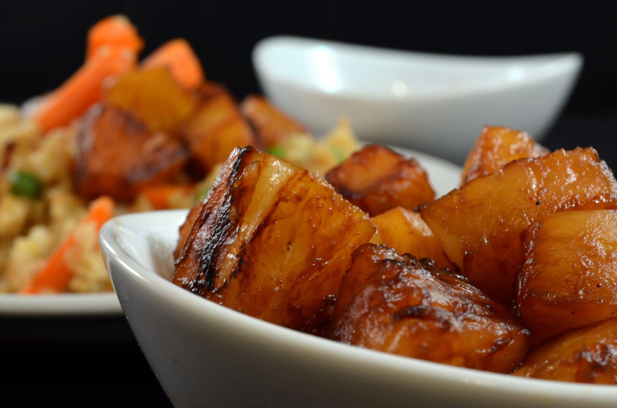 Close up view of pineapple fried rice on a plate.