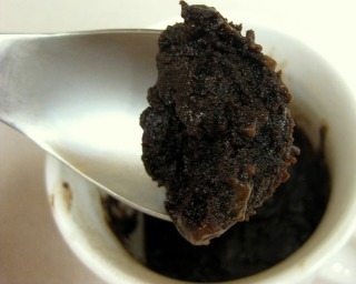 Close up view of a brownie in a mug.
