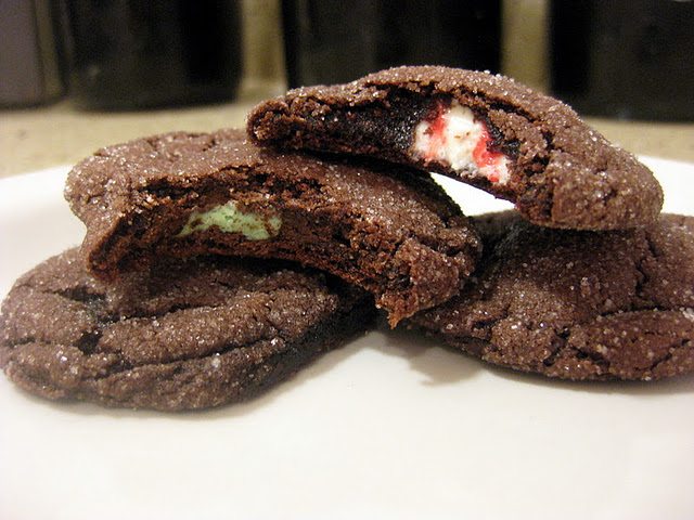 Close up view of chocolate mint cookies on a white plate.