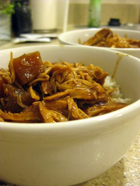 Close up view of hawaiian chicken in a white bowl.