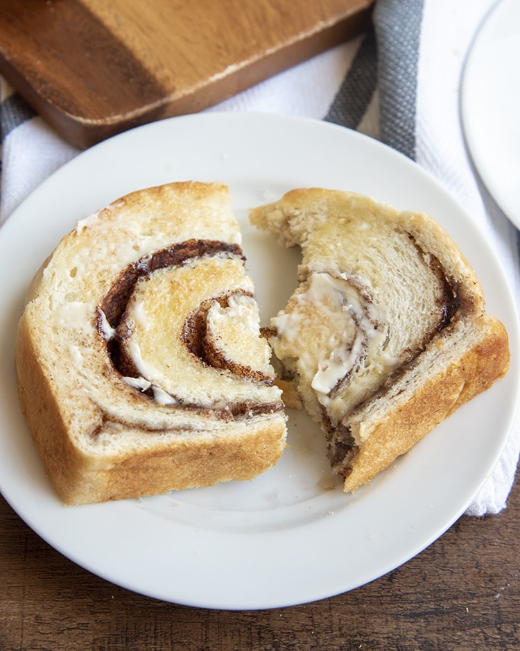 A slice of cinnamon bread on a white plate