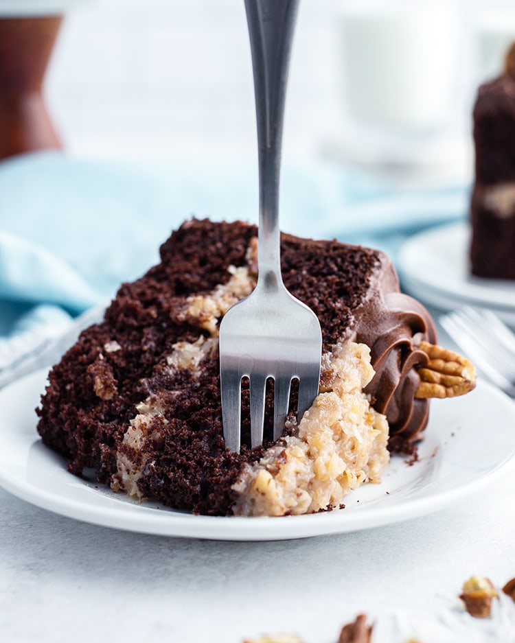 A slice of German Chocolate Cake with a fork in it