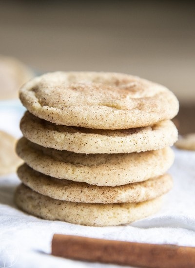 Front view of snickerdoodle cookies on a white plate.