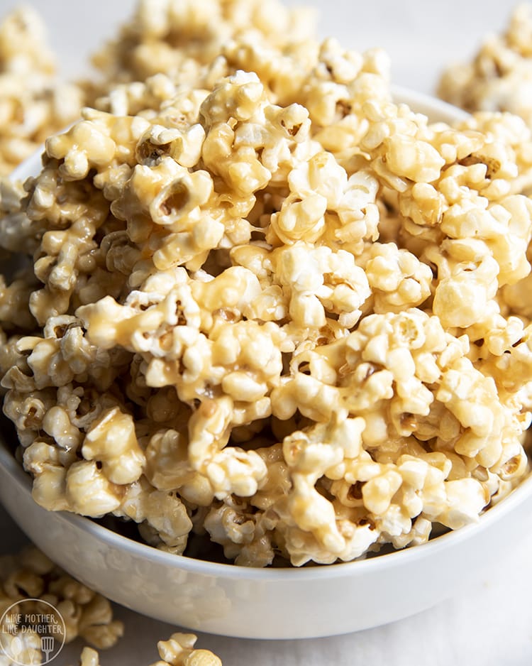 This gooey caramel popcorn is the best, with a super easy microwavable caramel coating, you won't be able to resist going back for more!