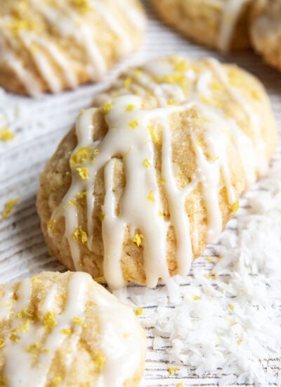 A pineapple coconut cookie topped with a glaze and lemon zest.