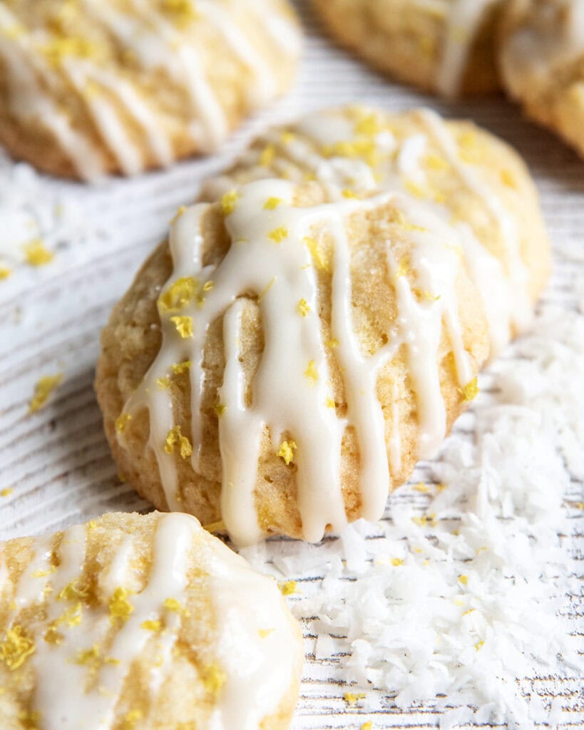 A pineapple coconut cookie topped with a glaze and lemon zest.