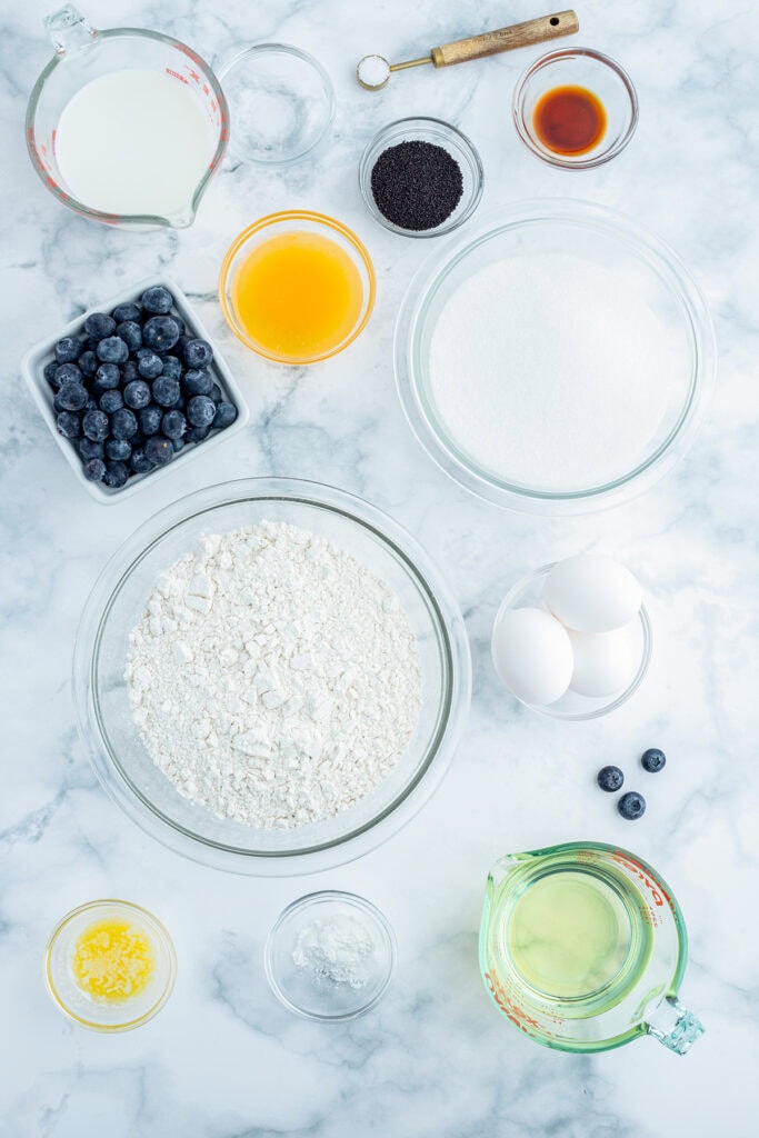 The Ingredients needed to make blueberry poppyseed bread with an orange glaze. 