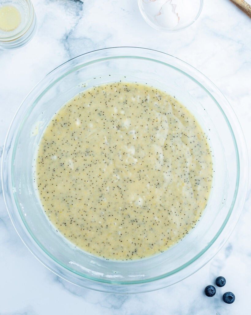 A bowl of poppyseed bread batter. 