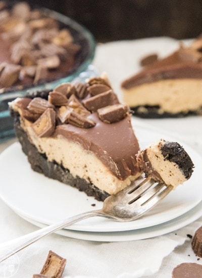 A piece of peanut butter pie topped with chocolate ganache.