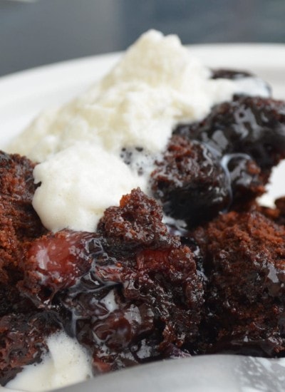 Close up view of chocolate berry cobbler on a plate.