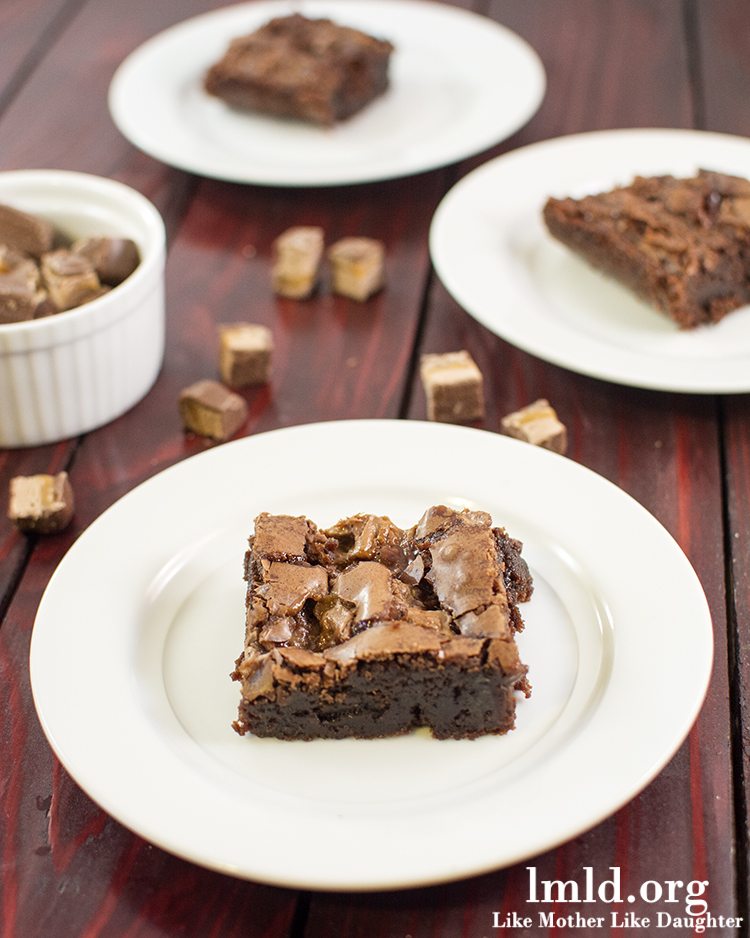 Front view of milky way brownies on white plates.