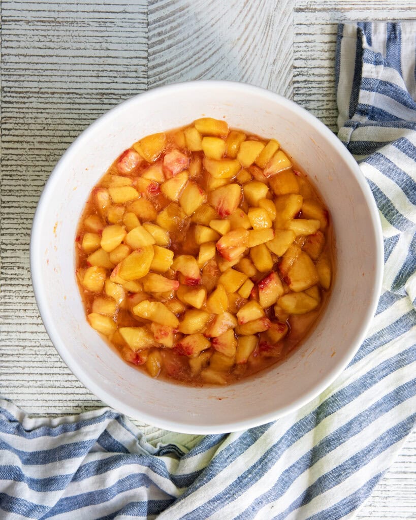 A bowl of macerated peaches.