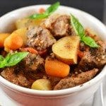 Angled view of crockpot beef stew in a bowl.