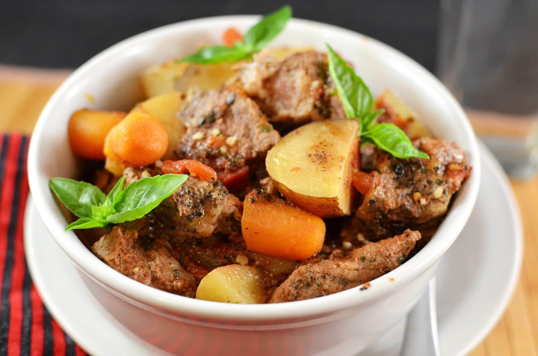 Angled view of crockpot beef stew in a bowl.