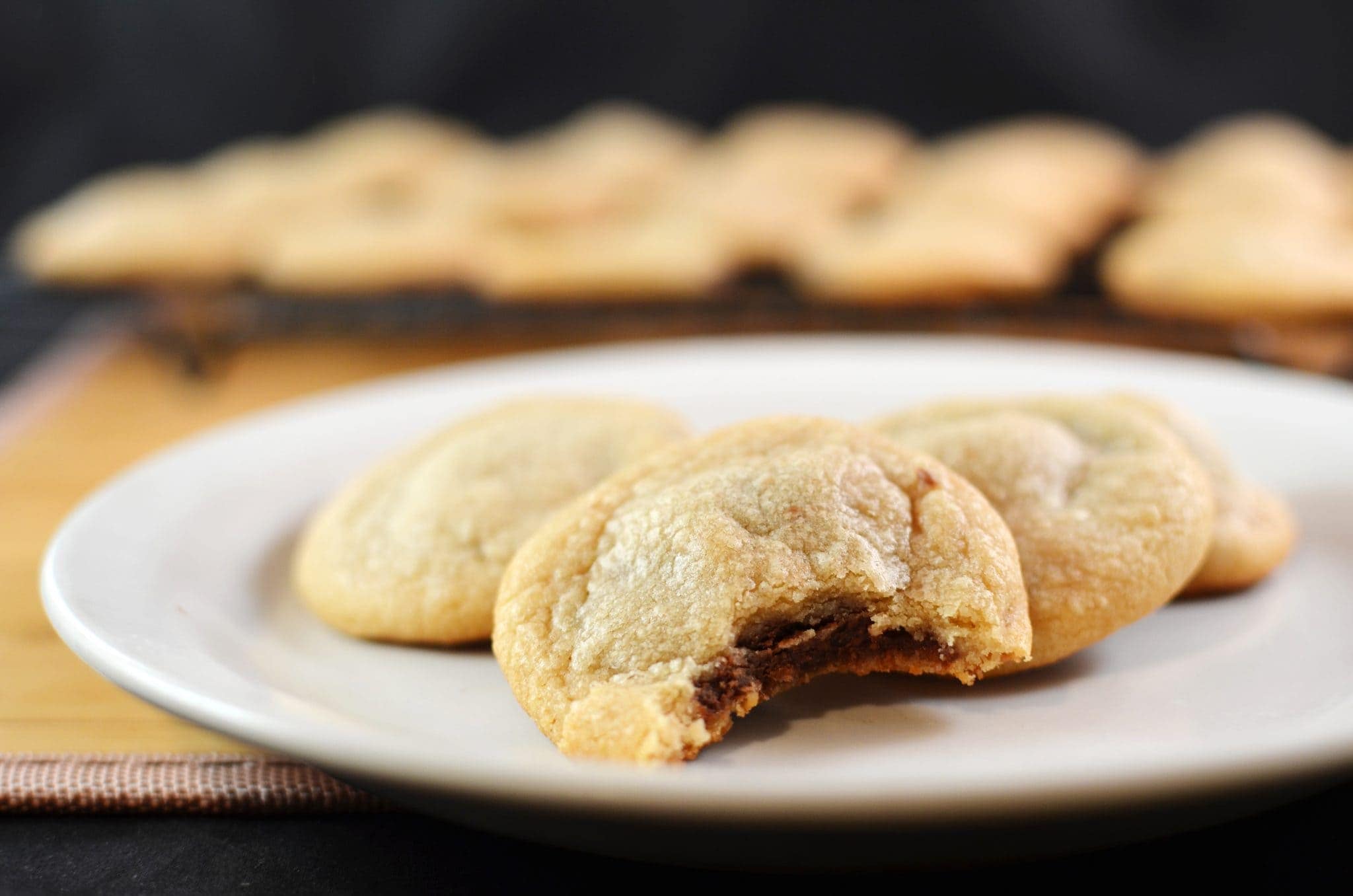 014 Front view of a chocolate filled cookie on a plate.