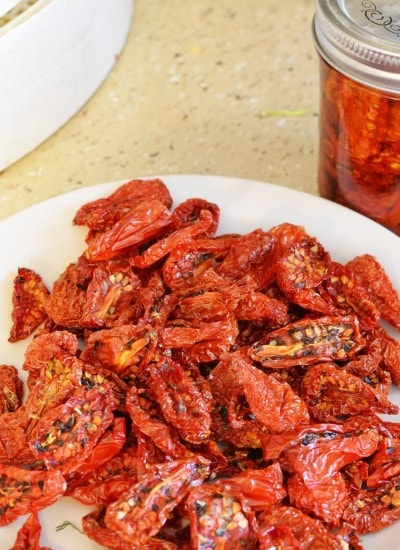 Top view of sun dried tomatoes on a white plate.
