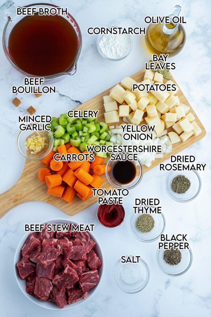 An above view of the ingredients needed to make crockpot beef stew.