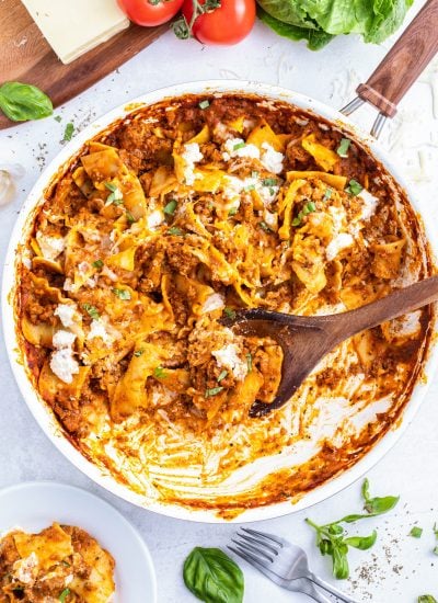 A pan full of skillet lasagna topped with ricotta dollops.