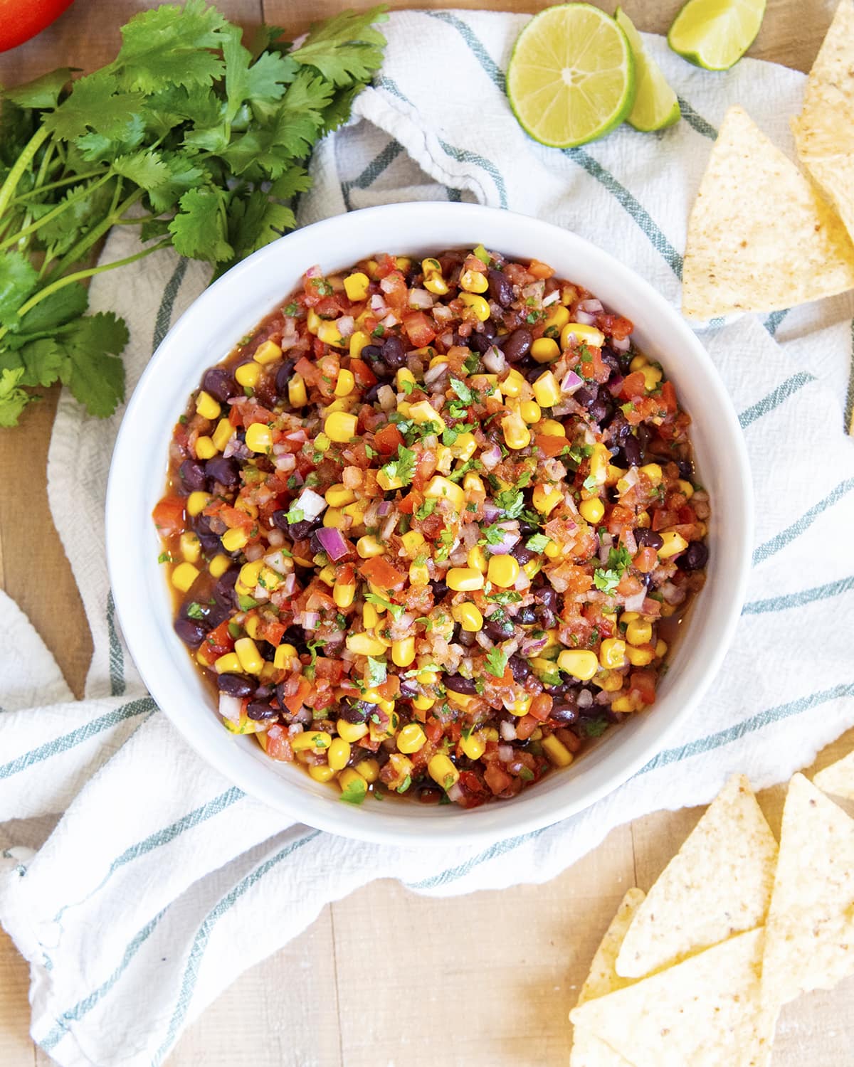 An overhead photo of a bowl of salsa with corn and black beans.