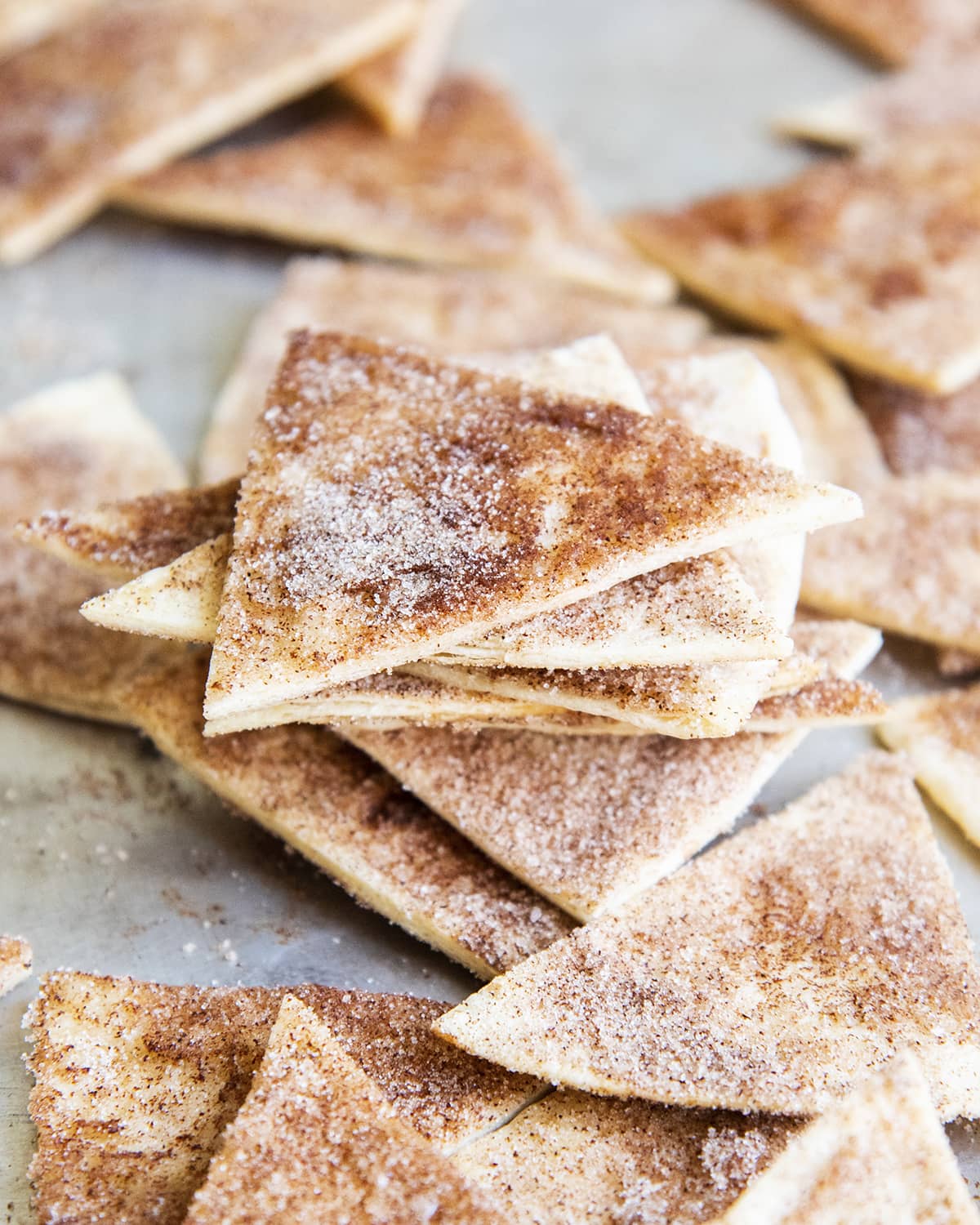 A stack of cinnamon chips on a baking pan.