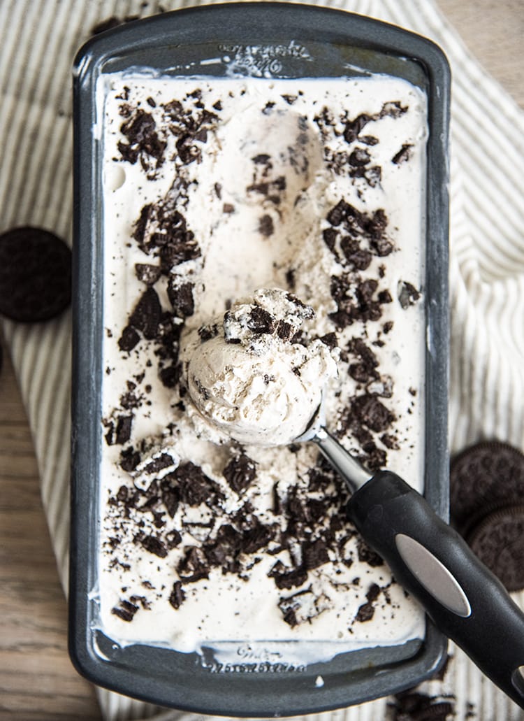 A scoop of cookies and cream ice cream in an ice cream scoop