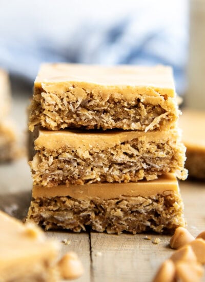 A stack of three oatmeal cookie bars topped with a butterscotch glaze.