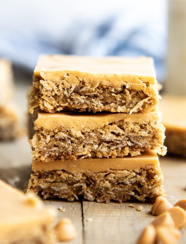 A stack of three oatmeal cookie bars topped with a butterscotch glaze.
