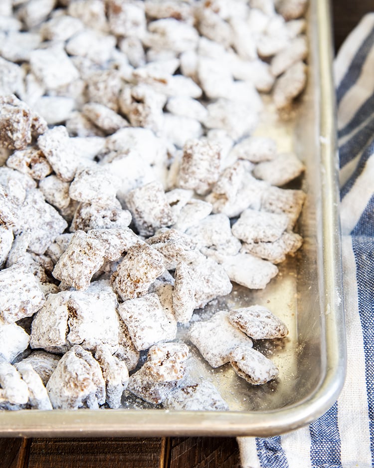 A pan full of muddy buddies made of chex cereal.
