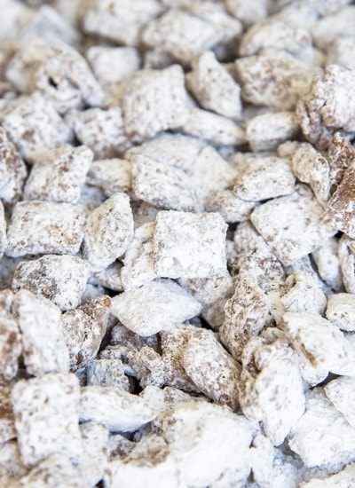 A close up on muddy buddies, which shows the chex cereal coated in chocolate, and powdered sugar.